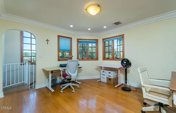 a view of a balcony with a tree