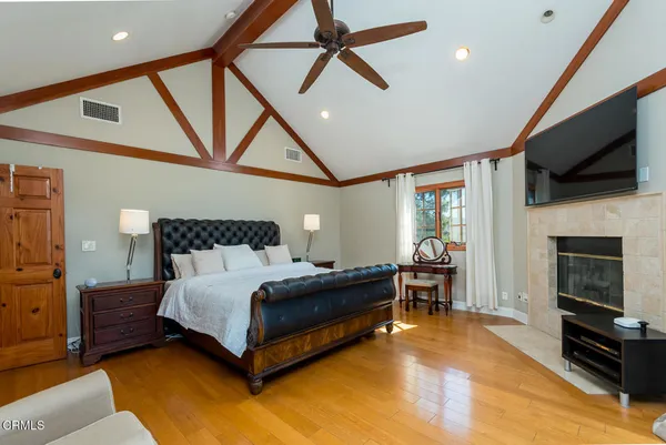 a bathroom with a tub shower and a sink