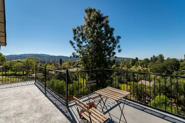 a view of a chairs and tables in the patio