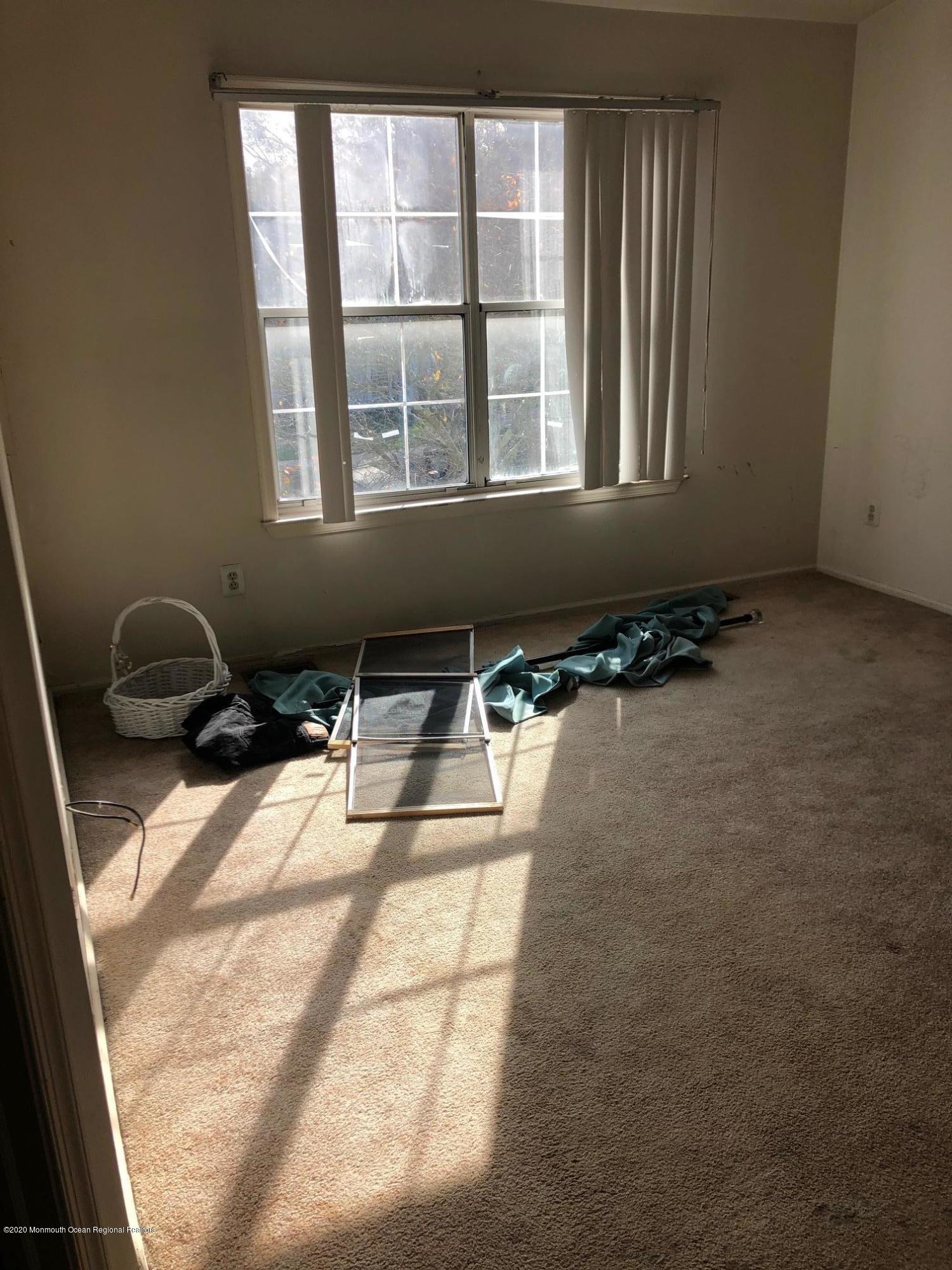 276 Sugar Maple Court Howell, NJ 07731 - Photo 4 of 16 a backyard of a house with table and chairs