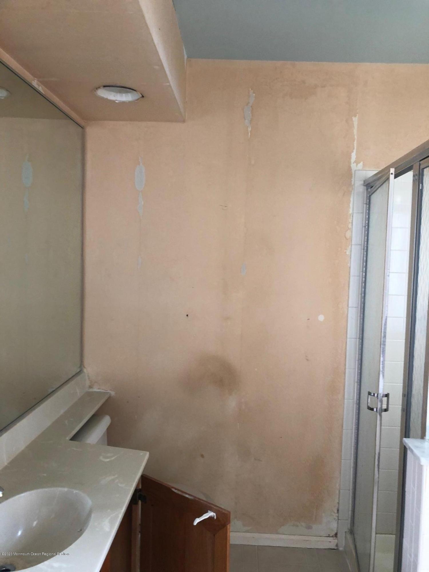 276 Sugar Maple Court Howell, NJ 07731 - Photo 7 of 16 a bathroom with a sink and shower