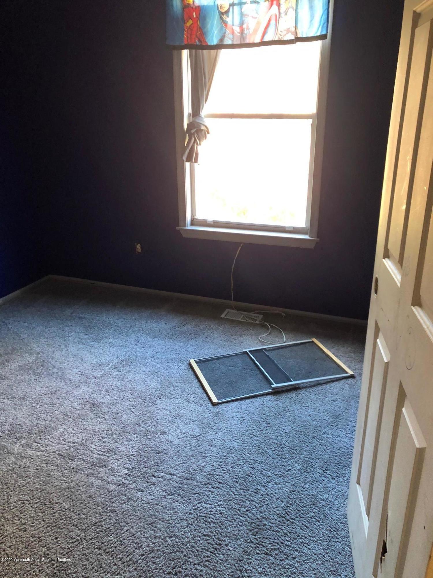 276 Sugar Maple Court Howell, NJ 07731 - Photo 9 of 16 an empty room with windows