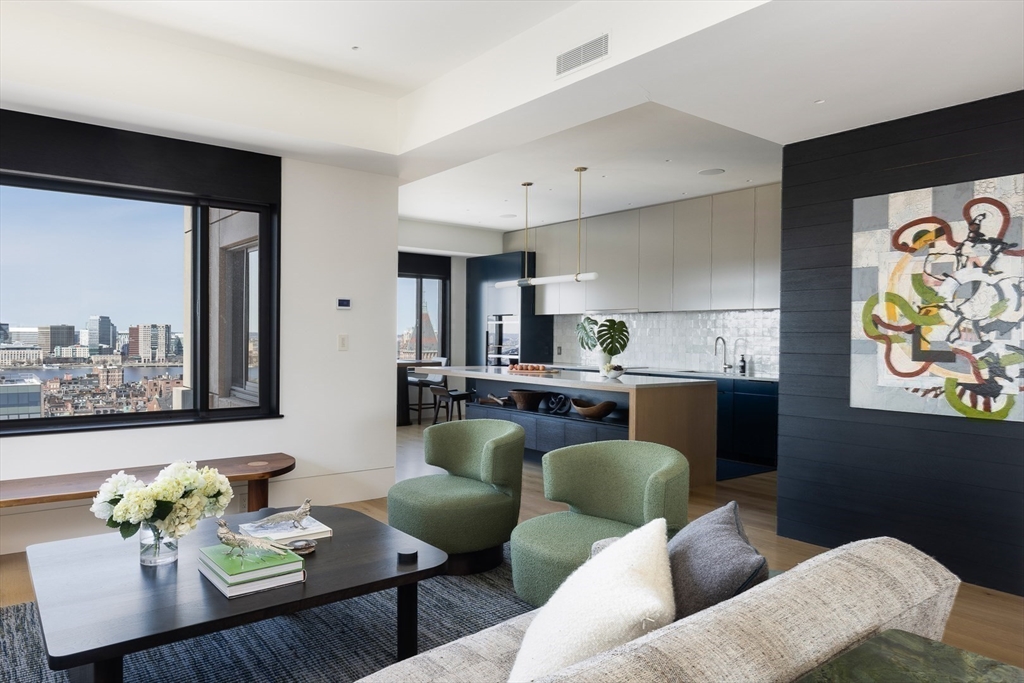1 Huntington Avenue, Unit 1702 Boston, MA 02116 - Photo 11 of 42 a living room with furniture kitchen view and a window