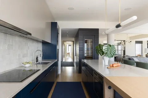 a kitchen with counter top space a sink and cabinets