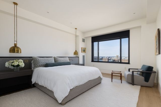 a bedroom with a bed and dresser