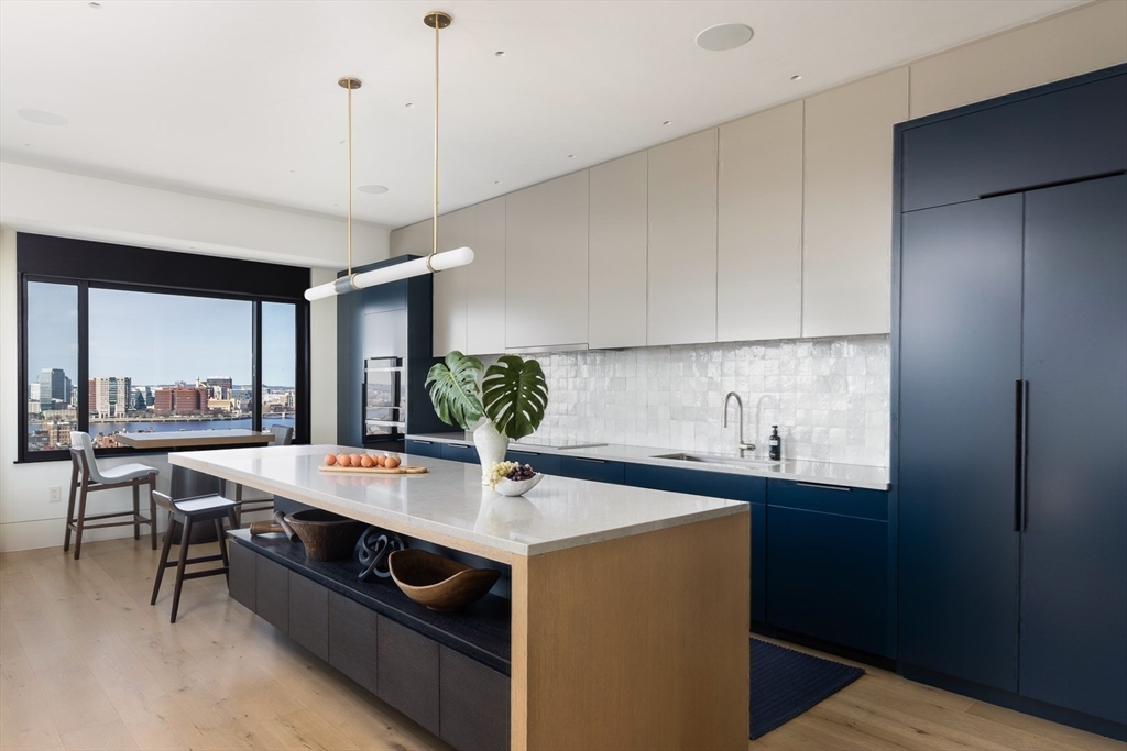 1 Huntington Avenue, Unit 1702 Boston, MA 02116 - Photo 3 of 42 a kitchen with stainless steel appliances a sink a stove and a refrigerator