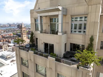 an aerial view of a balcony with city view