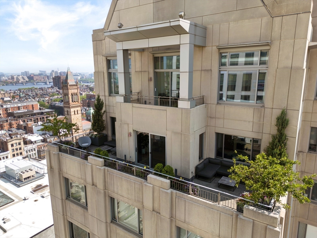 1 Huntington Avenue, Unit 1702 Boston, MA 02116 - Photo 38 of 42 a view of a building with many windows