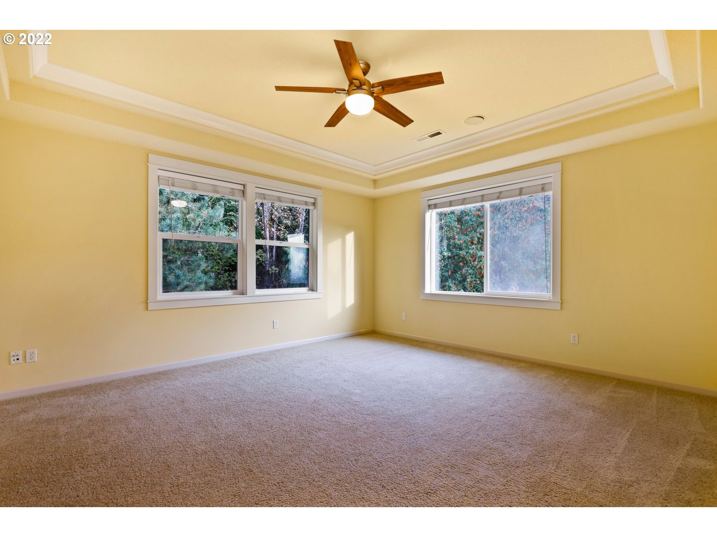 3237 Ridge Pointe Drive Forest Grove, OR 97116 - Photo 18 of 32 an empty room with windows and ceiling fan