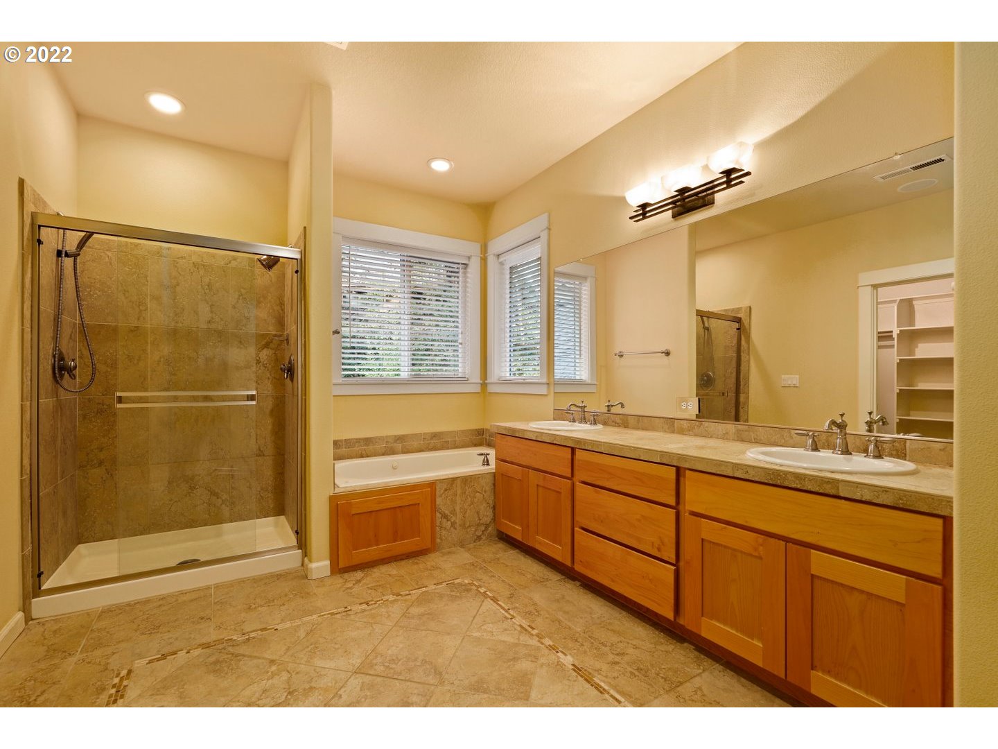 3237 Ridge Pointe Drive Forest Grove, OR 97116 - Photo 20 of 32 a bathroom with a granite countertop sink mirror and a bathtub