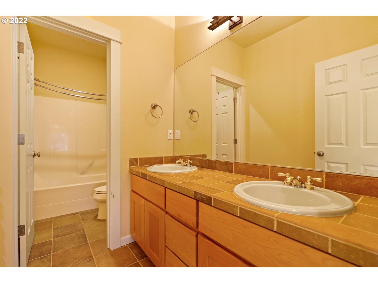3237 Ridge Pointe Drive Forest Grove, OR 97116 - Photo 25 of 32 a bathroom with a sink and a mirror