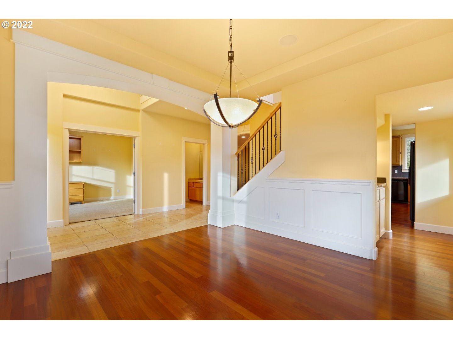 3237 Ridge Pointe Drive Forest Grove, OR 97116 - Photo 5 of 32 a view of a room with wooden floor and a chandelier