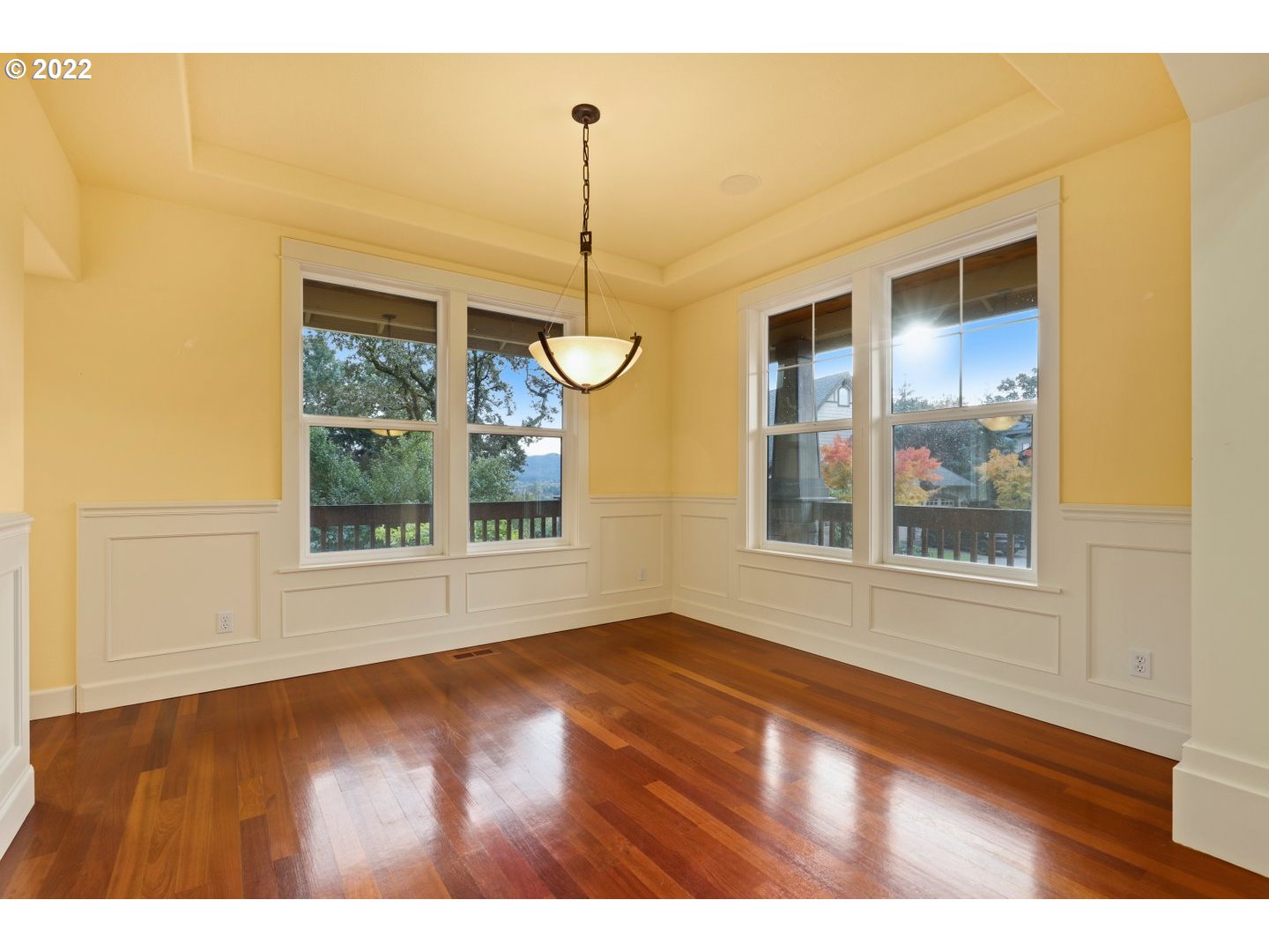 3237 Ridge Pointe Drive Forest Grove, OR 97116 - Photo 6 of 32 a view of an empty room with a window and wooden floor