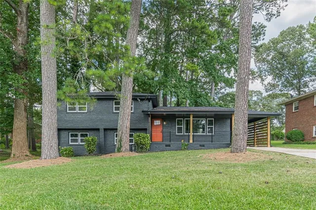 front view of a house with a yard