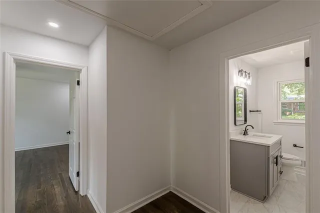 a bathroom with a sink and mirror