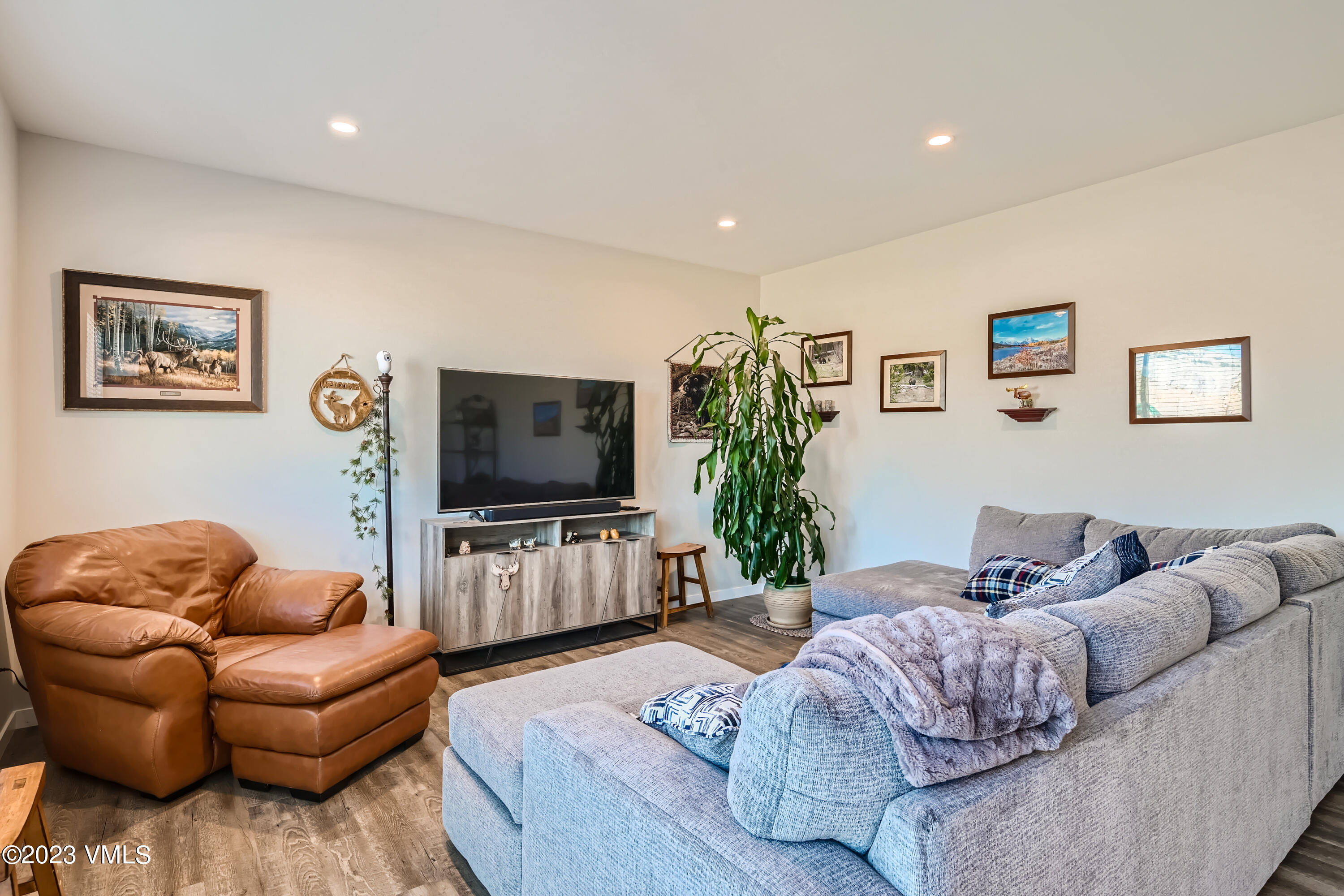 604 Chickadee Lane Gypsum, CO 81637 - Photo 2 of 11 a living room with furniture and a flat screen tv