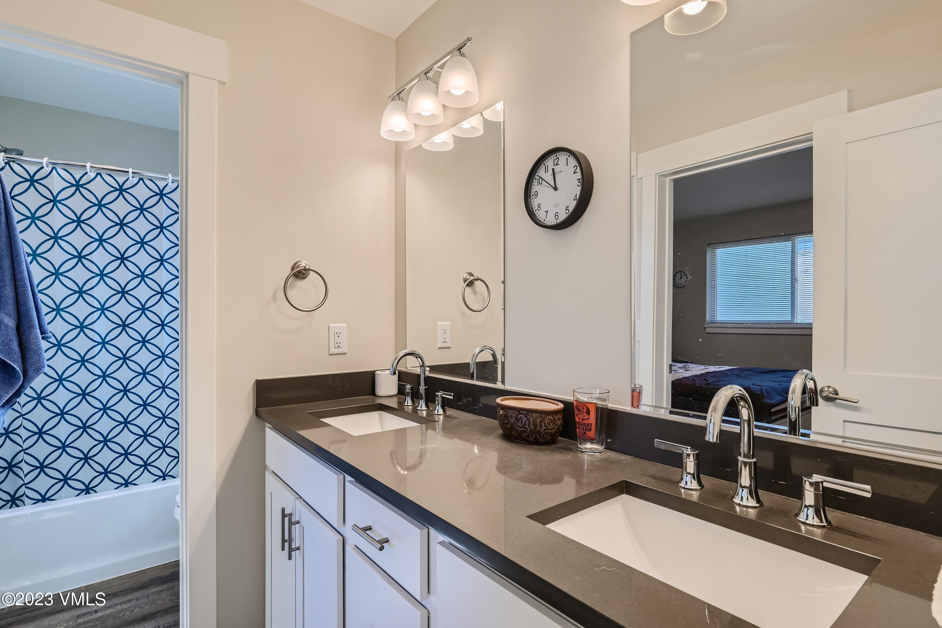 604 Chickadee Lane Gypsum, CO 81637 - Photo 6 of 11 a bathroom with a double vanity sink and a mirror