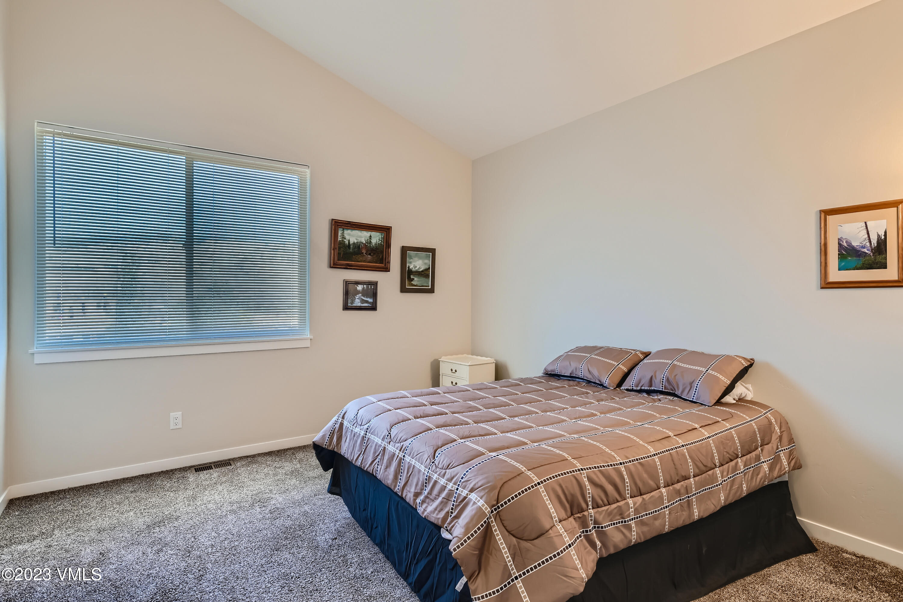 604 Chickadee Lane Gypsum, CO 81637 - Photo 8 of 11 a bedroom with a bed and night stand