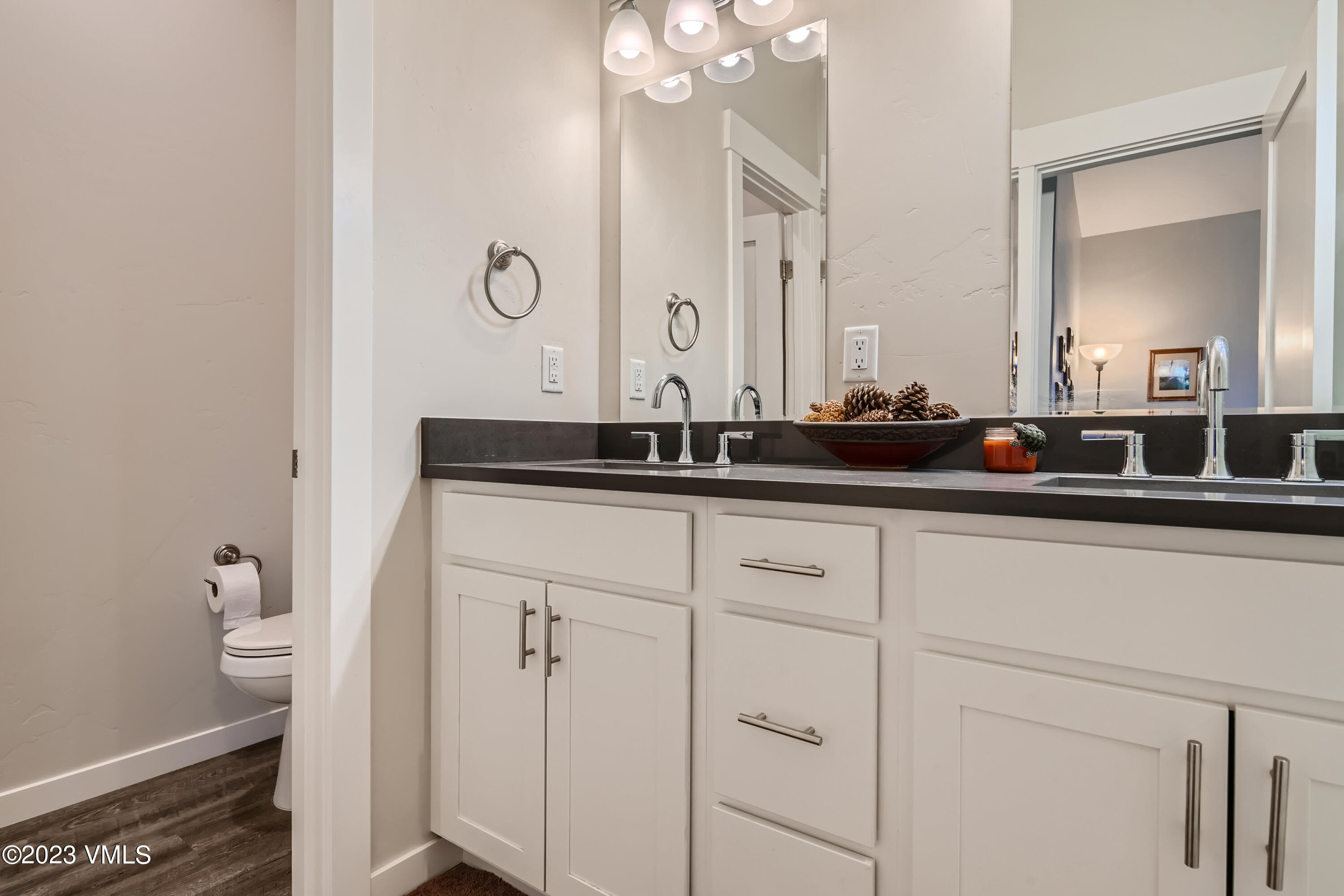 604 Chickadee Lane Gypsum, CO 81637 - Photo 9 of 11 a bathroom with a sink and a mirror