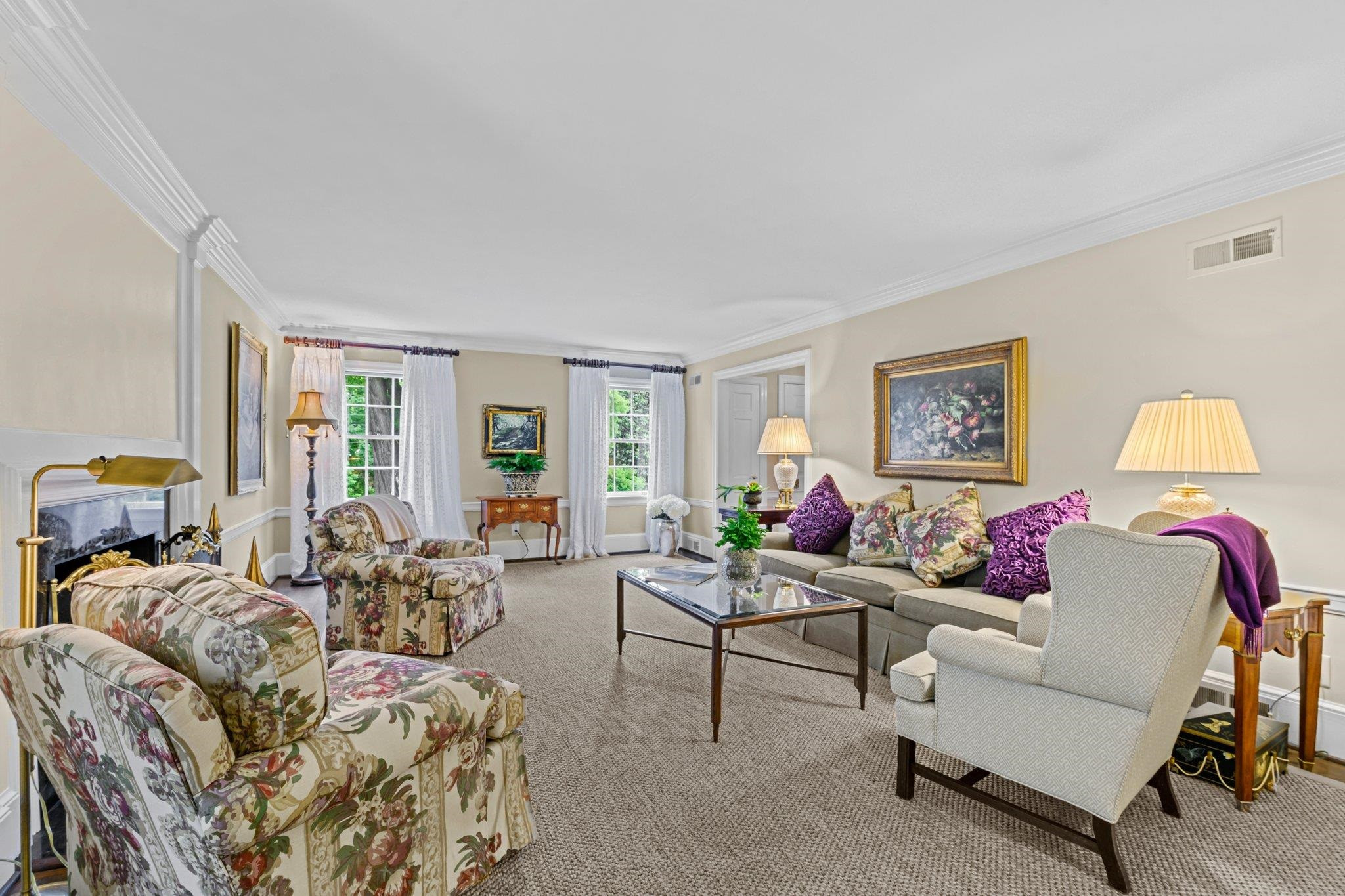 2217 St Marys Street Raleigh, NC 27608 - Photo 25 of 52 Formal living room featuring crown molding, smooth ceilings, and fireplace. Living Room