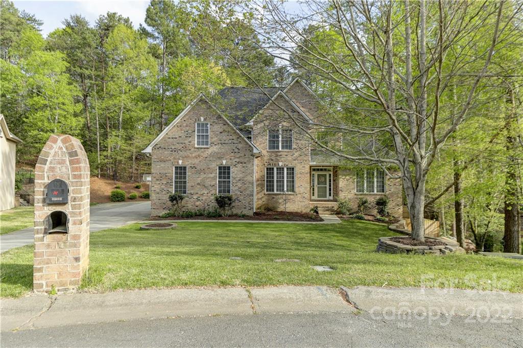 11111 Broken Brook Way Tega Cay, SC 29708 - Photo 1 of 46 a front view of a house with a garden