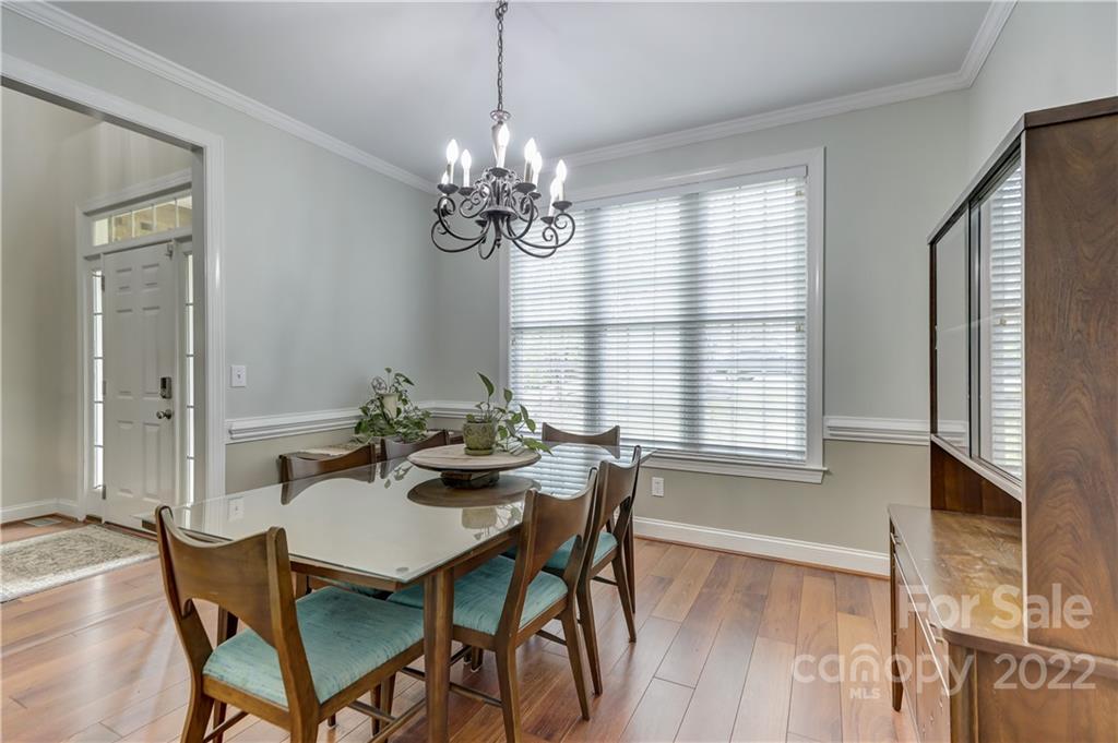 11111 Broken Brook Way Tega Cay, SC 29708 - Photo 4 of 46 a view of a dining room with furniture window and wooden floor