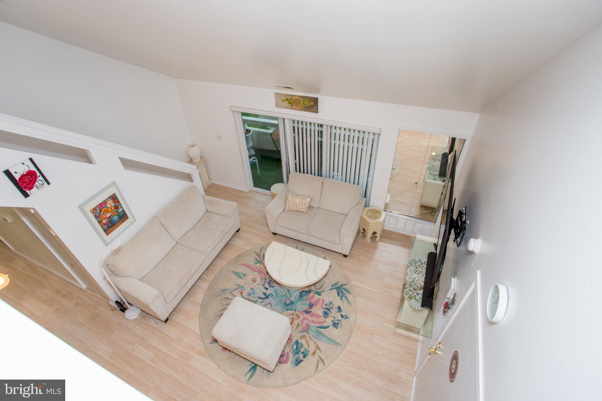 48 Bonnie Gellman Court, Unit B48 Philadelphia, PA 19114 - Photo 13 of 70 a living room with furniture and a rug