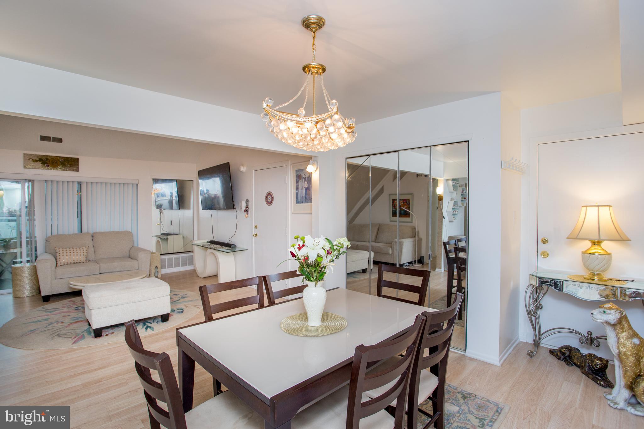 48 Bonnie Gellman Court, Unit B48 Philadelphia, PA 19114 - Photo 15 of 70 a view of a dining room with furniture and a chandelier