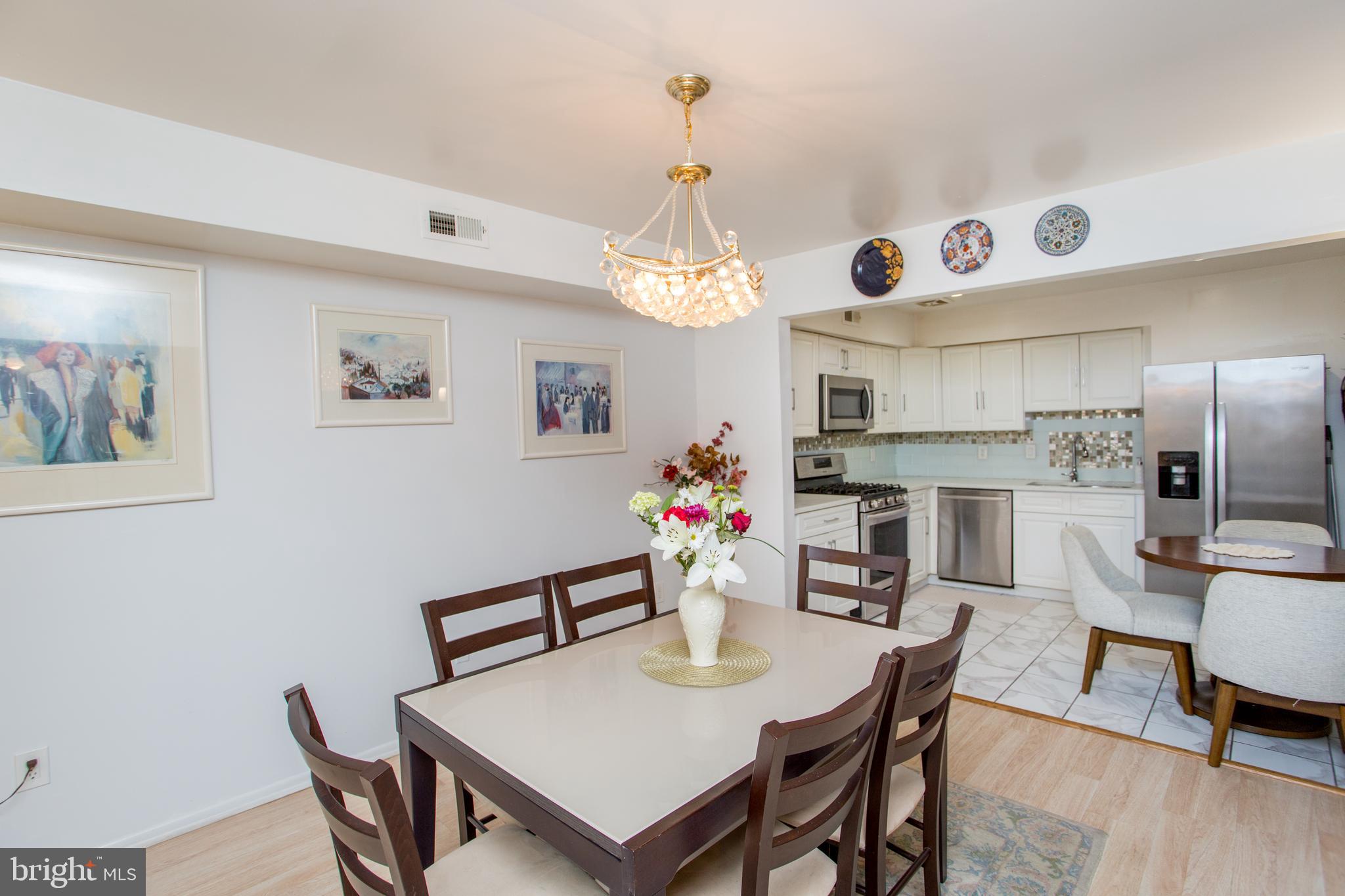 48 Bonnie Gellman Court, Unit B48 Philadelphia, PA 19114 - Photo 18 of 70 a view of a dining room with furniture and wooden floor