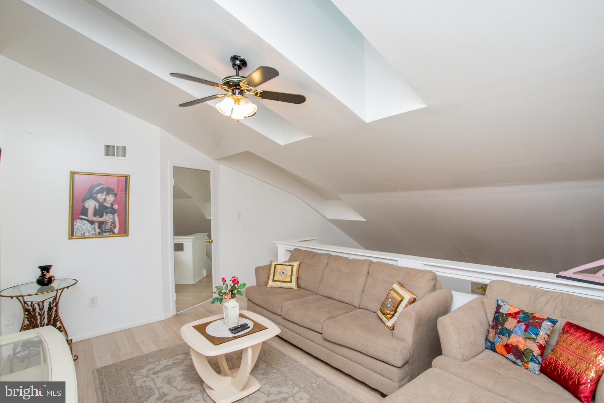 48 Bonnie Gellman Court, Unit B48 Philadelphia, PA 19114 - Photo 28 of 70 a living room with furniture and a rug