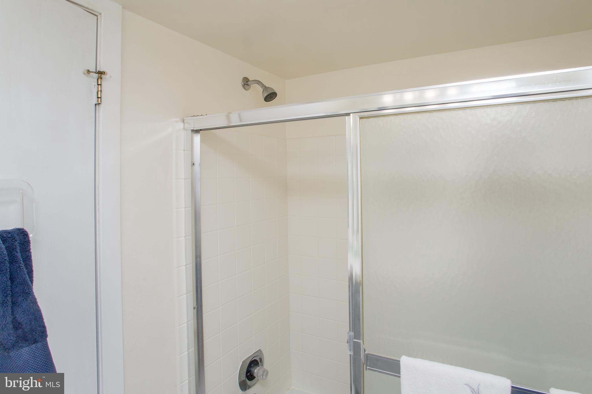 48 Bonnie Gellman Court, Unit B48 Philadelphia, PA 19114 - Photo 45 of 70 a bathroom with a glass shower door
