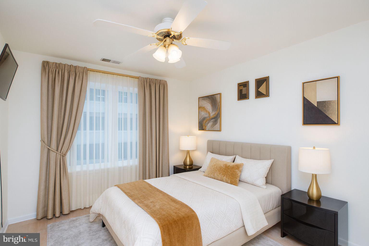 48 Bonnie Gellman Court, Unit B48 Philadelphia, PA 19114 - Photo 6 of 70 a bedroom with a bed and a lamp