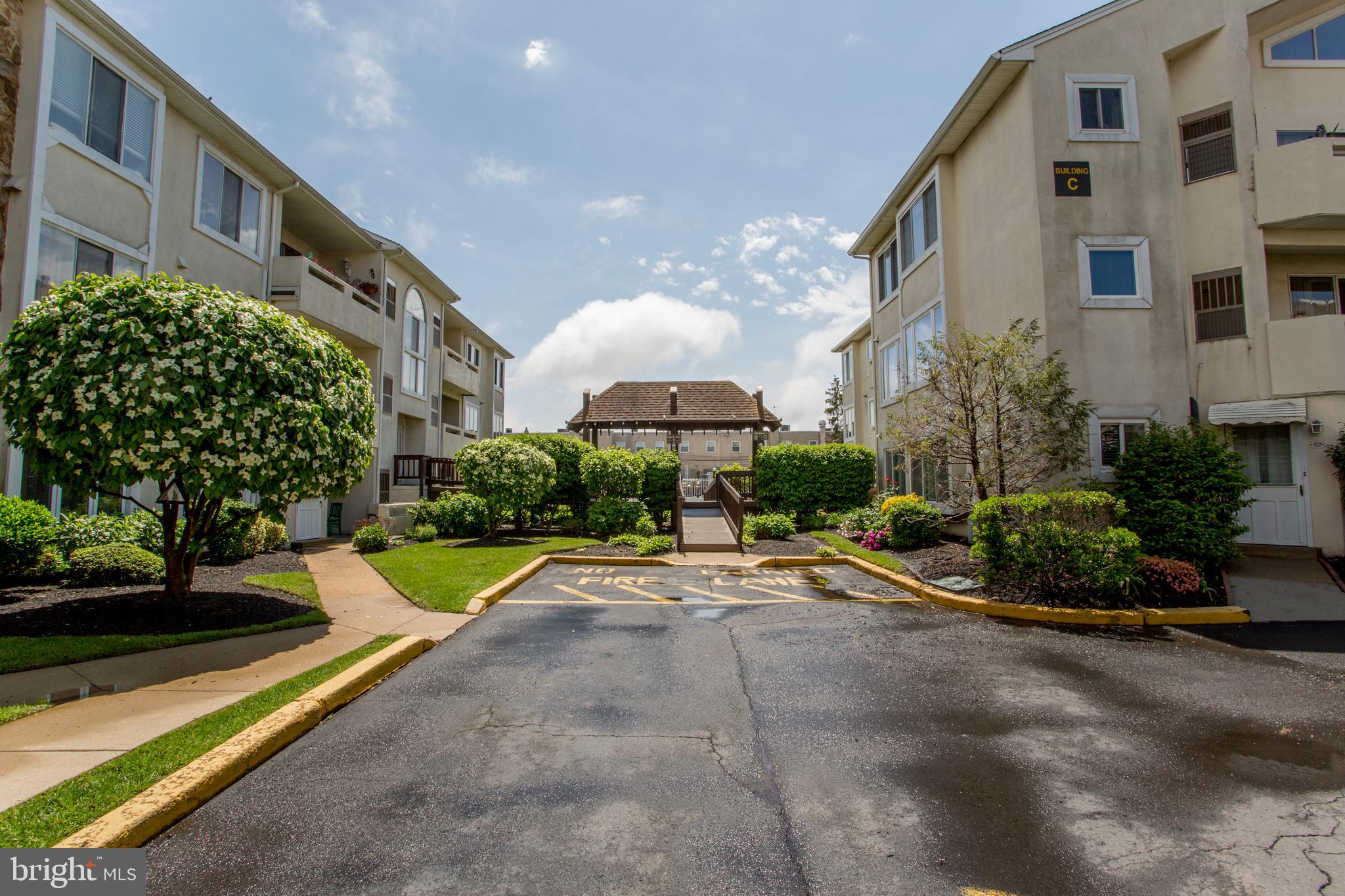 48 Bonnie Gellman Court, Unit B48 Philadelphia, PA 19114 - Photo 68 of 70 a view of a backyard with plants and patio