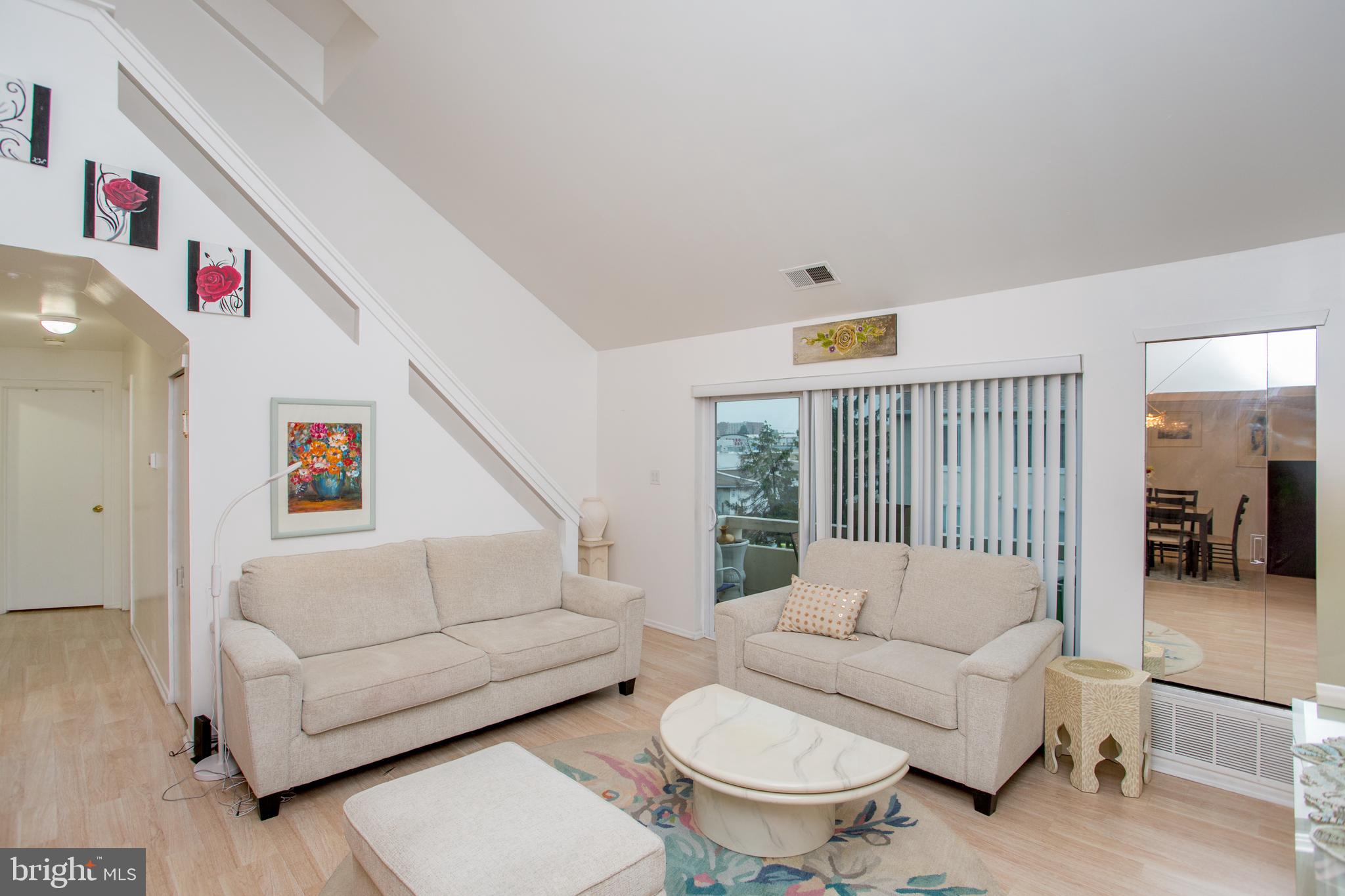 48 Bonnie Gellman Court, Unit B48 Philadelphia, PA 19114 - Photo 8 of 70 a living room with furniture and a large window