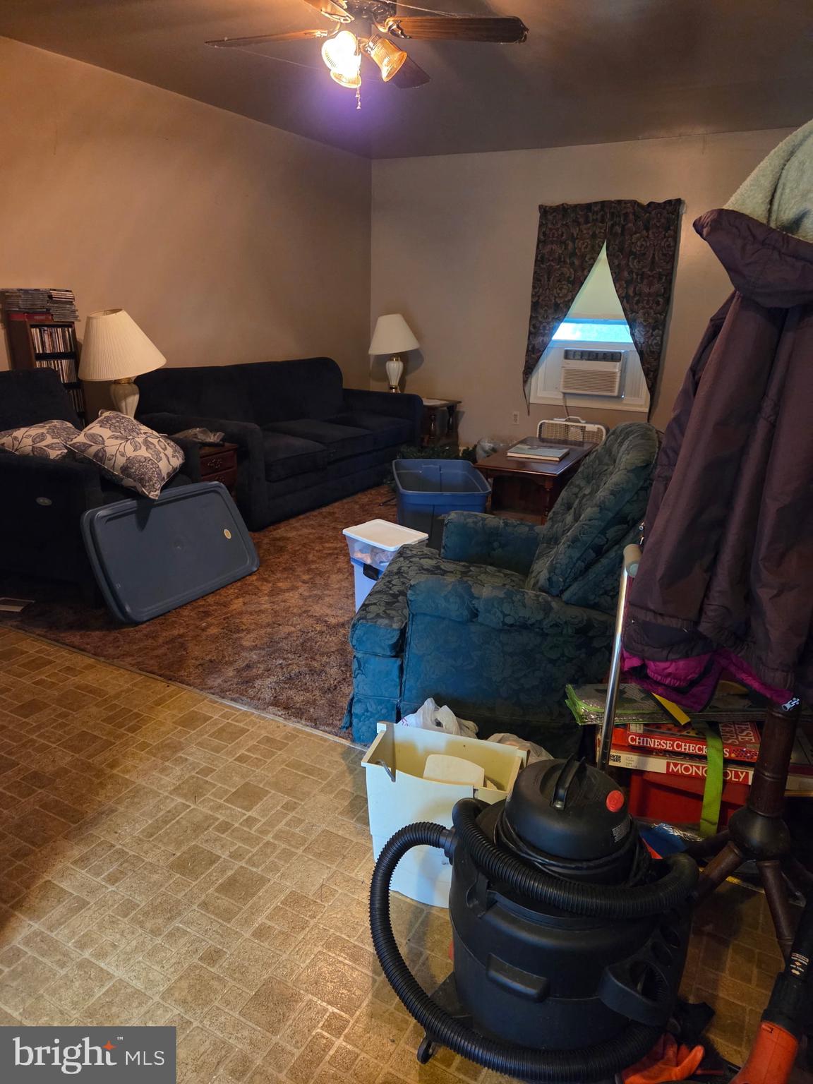 4942 Elizabethtown Road Manheim, PA 17545 - Photo 11 of 23 a living room with furniture and a fireplace