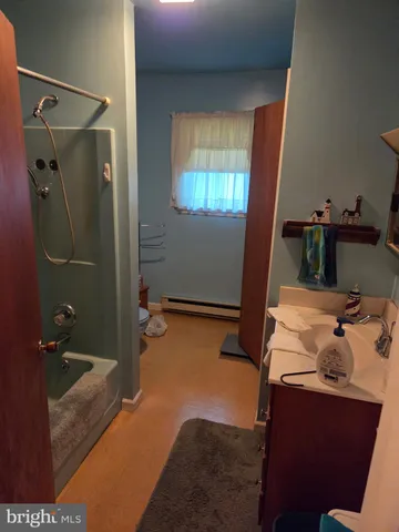 a bedroom with a bed and a desk