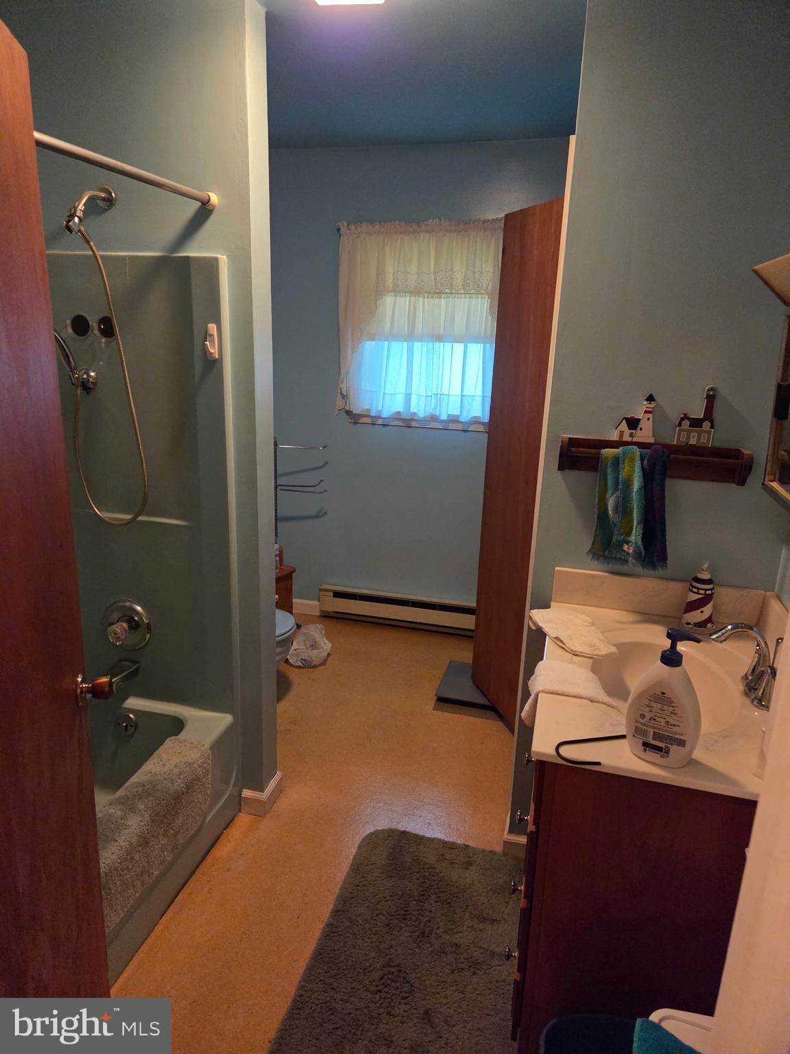 4942 Elizabethtown Road Manheim, PA 17545 - Photo 15 of 23 a bathroom with a granite countertop sink and a mirror