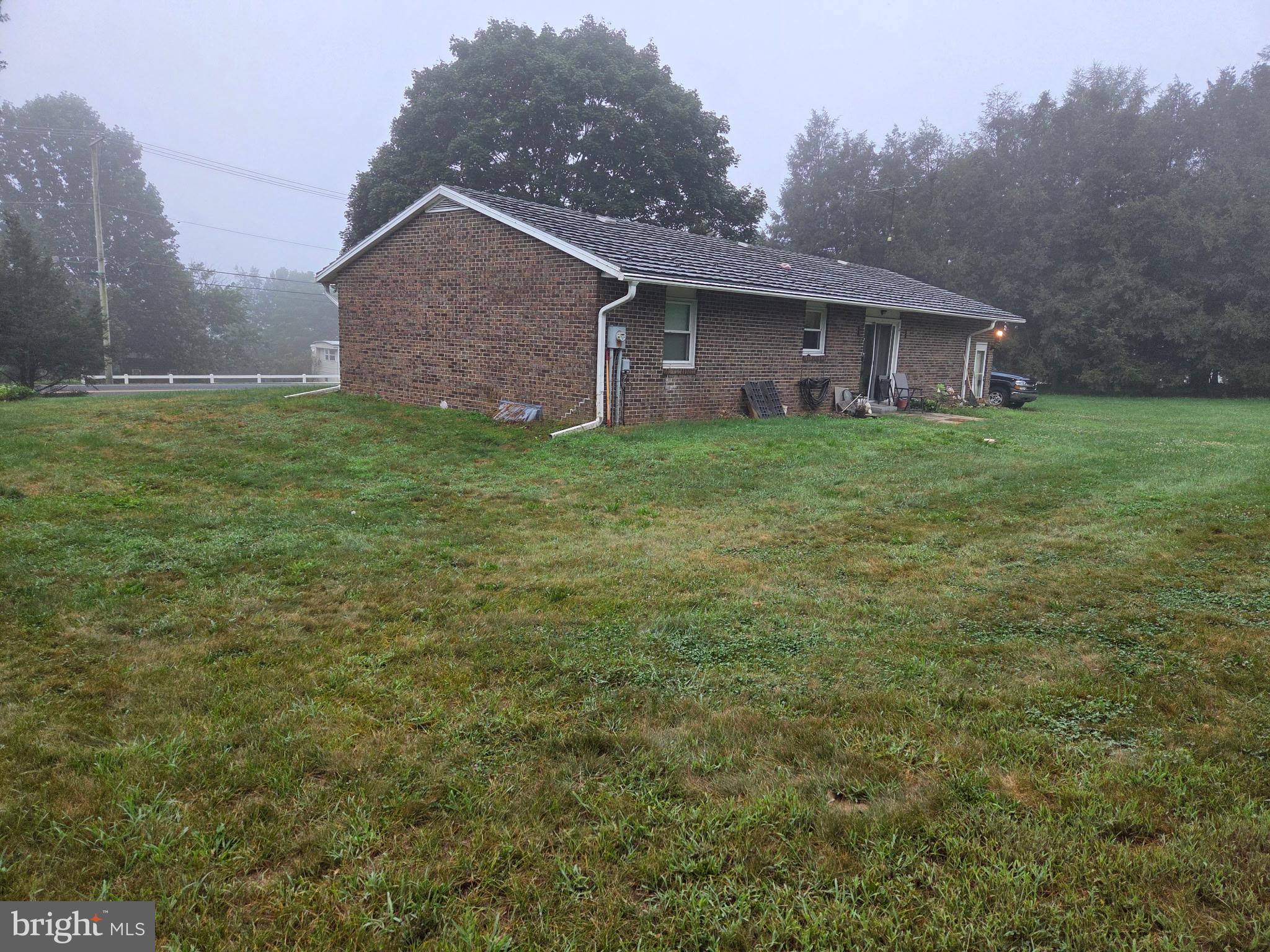 4942 Elizabethtown Road Manheim, PA 17545 - Photo 4 of 23 a front view of house with yard and green space