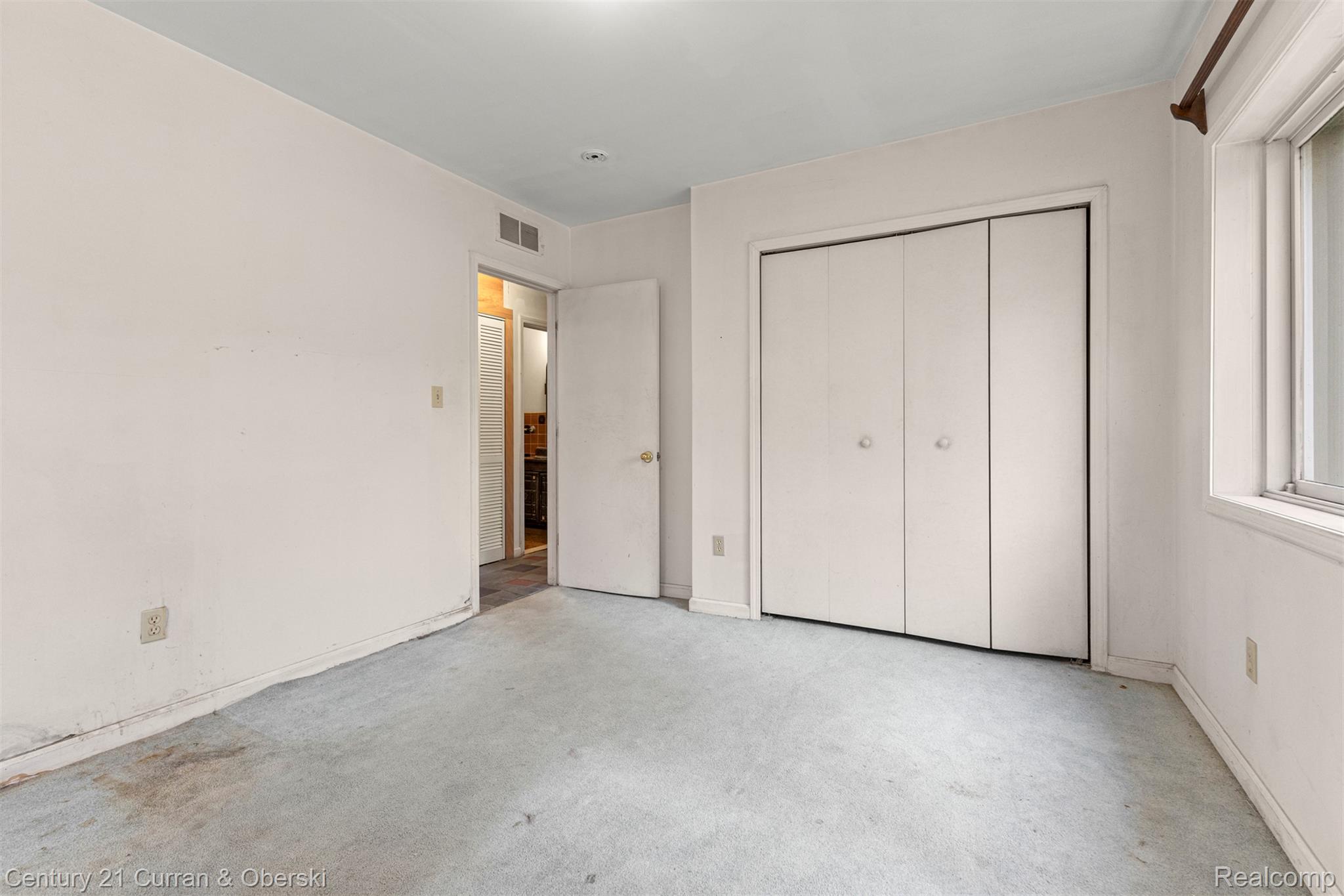 25205 Inkster Road Farmington, MI 48336 - Photo 23 of 46 Unfurnished bedroom with a closet and light carpet