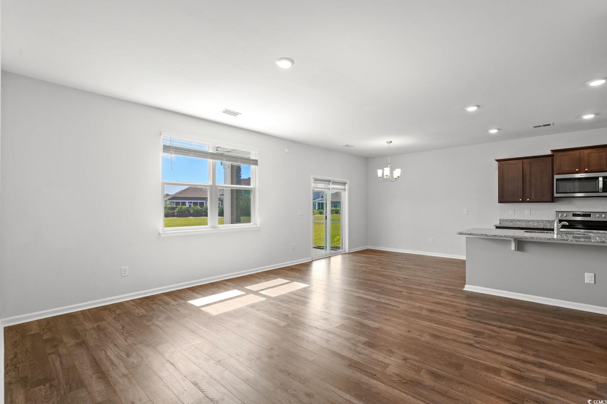 2631 Ophelia Way Myrtle Beach, SC 29577 - Photo 11 of 40 Unfurnished living room featuring a chandelier, dark wood-style floors, and recessed lighting