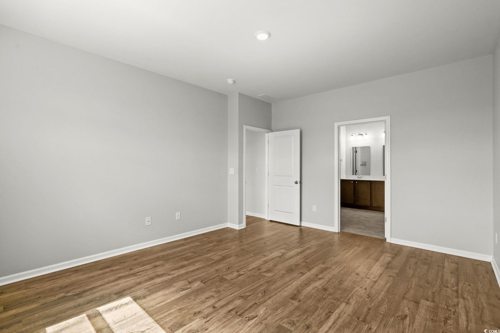 2631 Ophelia Way Myrtle Beach, SC 29577 - Photo 17 of 40 Unfurnished bedroom featuring wood finished floors and connected bathroom