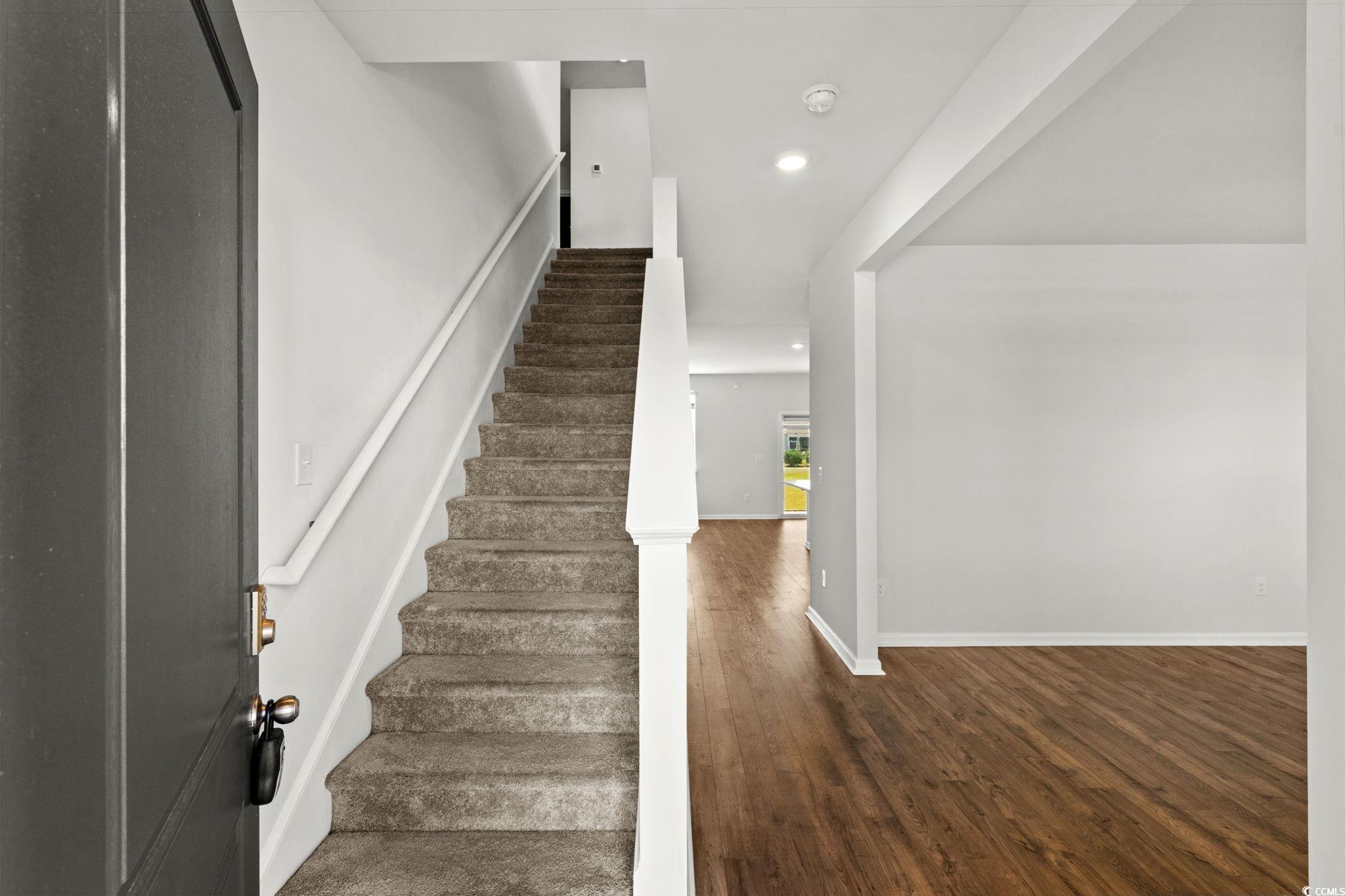 2631 Ophelia Way Myrtle Beach, SC 29577 - Photo 21 of 40 Stairs with wood finished floors and recessed lighting