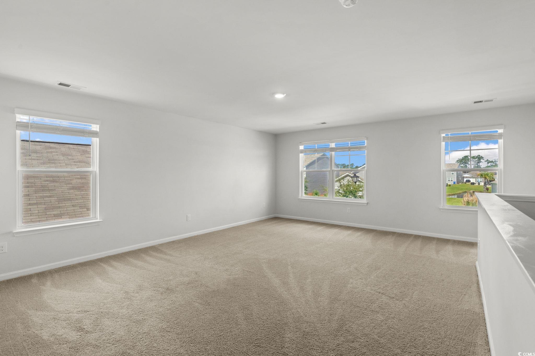 2631 Ophelia Way Myrtle Beach, SC 29577 - Photo 23 of 40 Empty room with healthy amount of natural light, light colored carpet, and recessed lighting