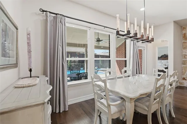 a kitchen with a table and chairs