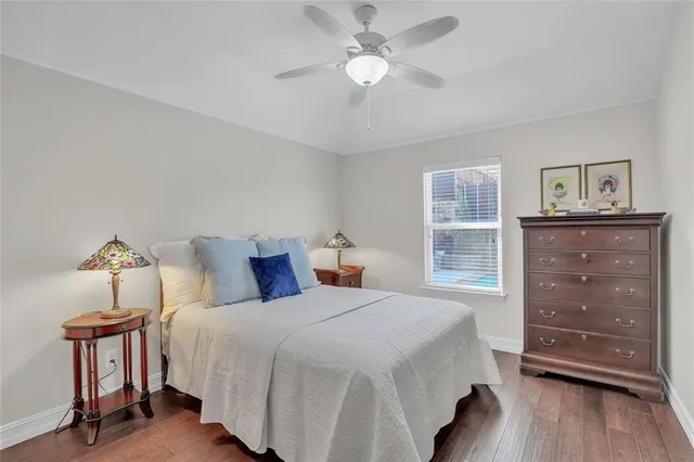 a bedroom with a bed and a table