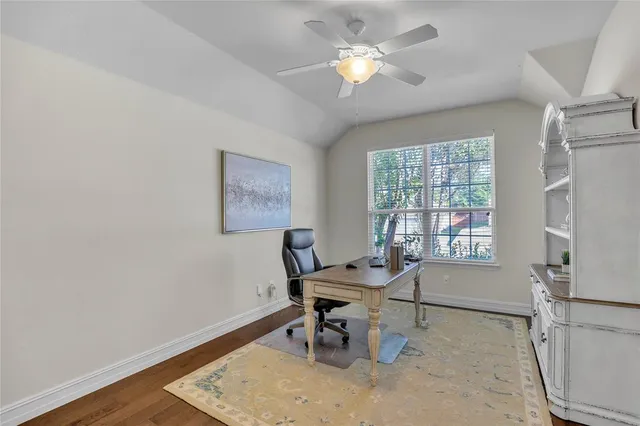 a workspace with furniture and mirror