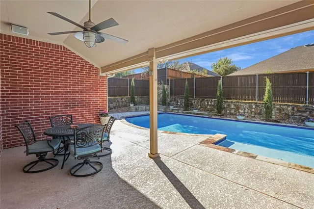 a outdoor dining space with furniture and wooden floor