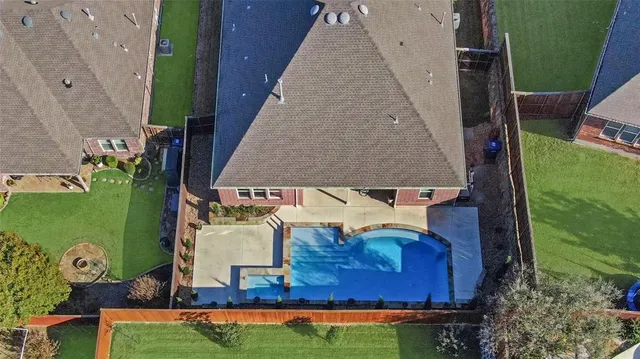 a living room with fireplace furniture and a wooden floor