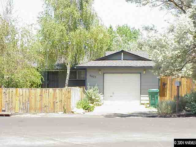8675 Paloma Way Reno, NV 89506 - Photo 1 of 1 front view of a house with a yard