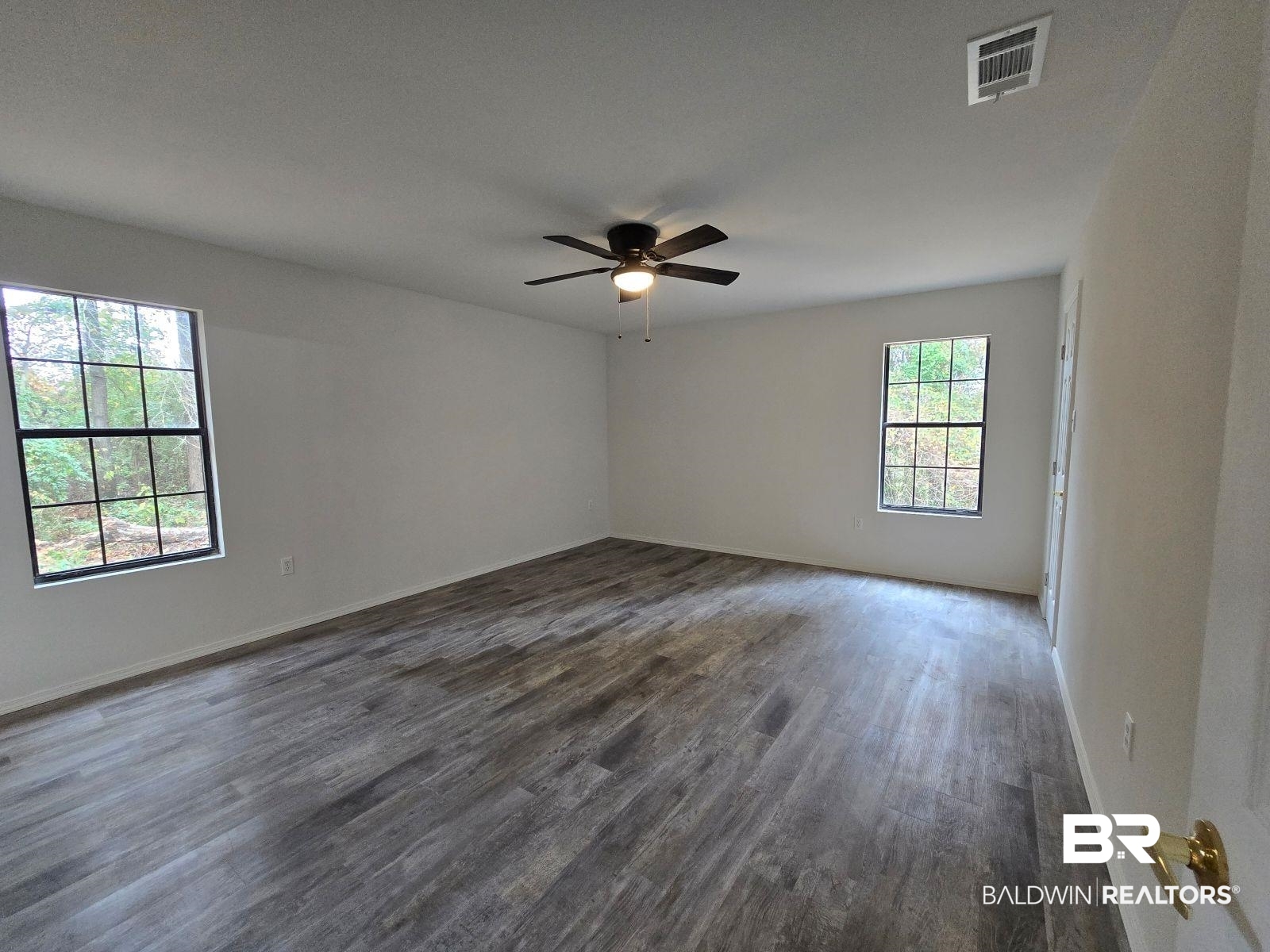 1600 Blair Road Brewton, AL 36426 - Photo 13 of 15 Unfurnished room featuring ceiling fan and dark hardwood / wood-style flooring